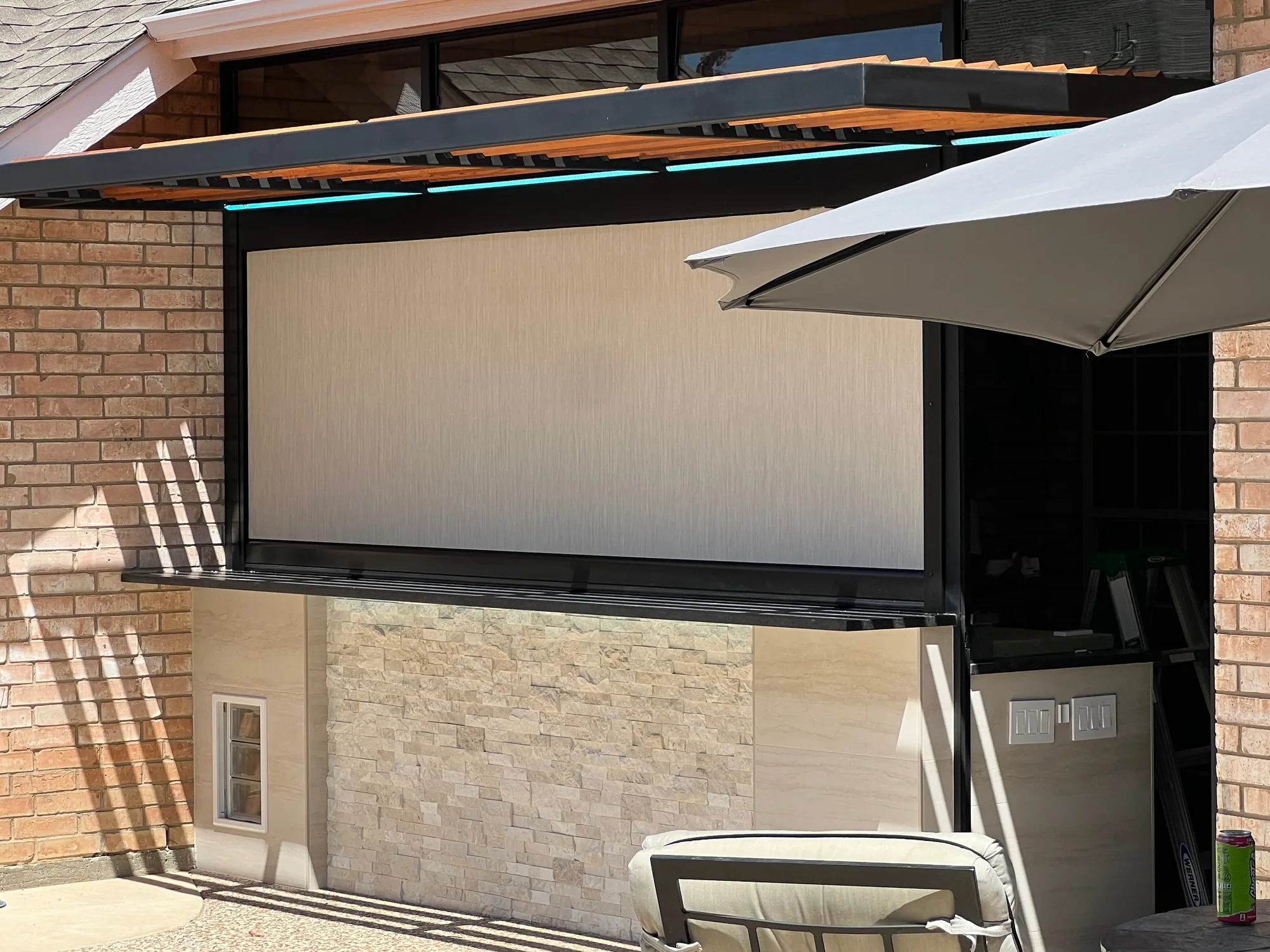 Exterior patio shades fitted to the window opening by Love Is Blinds