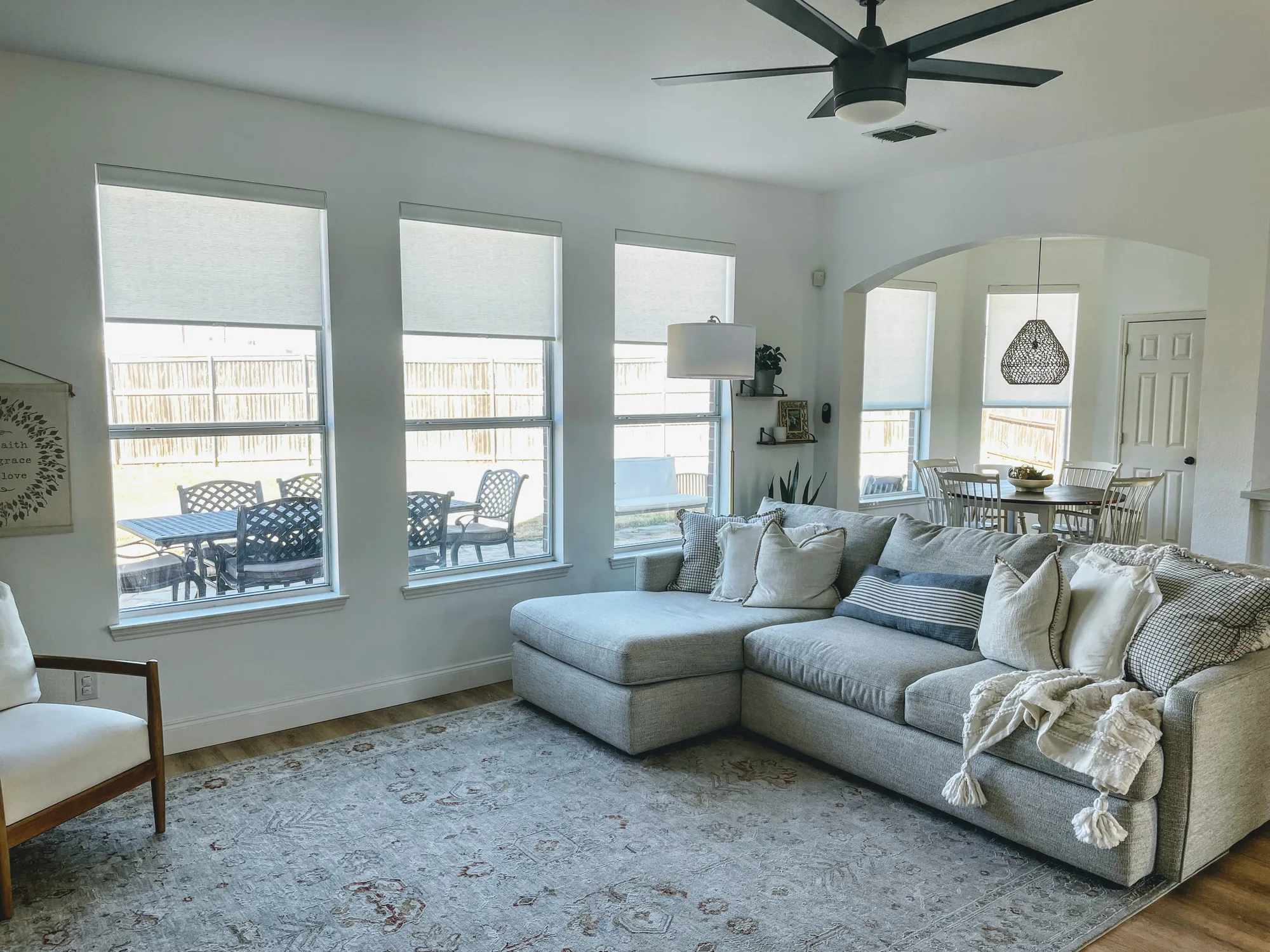 Light-filtering shades across a bright Texas living room