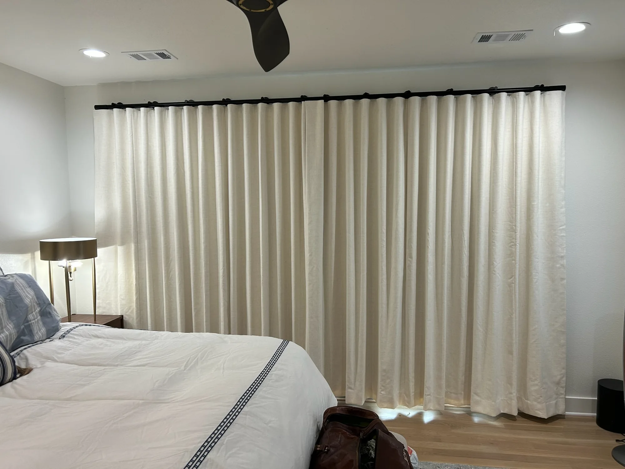 Drapery and motorization shading a Texas room in the afternoon
